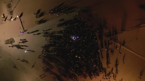 Aerial Vertical Drone Shot Above Crowd at Openair Concert at Night on the Coast