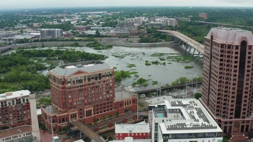 James River in Richmond Virginia. Aerial establishing shot of bridges across rocky water way in VA,