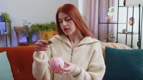 Young Woman with Cash and Piggy Bank