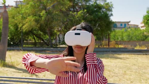 Woman Enjoying The VR Experience At The Park