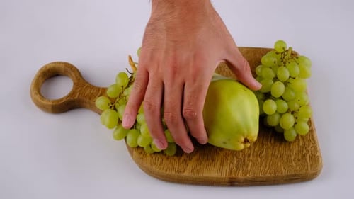 Green Grapes, Pear, and Apple on Cutting Board