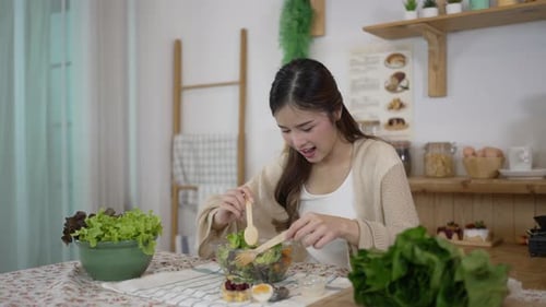 Young Woman Preparing a Fresh Healthy Salad