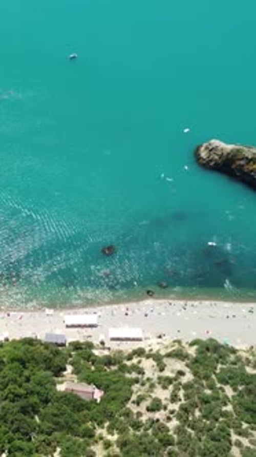 Aerial View on Summer Beach Swimming People in Sea Bay with Transparent Blue Water and Volcanic