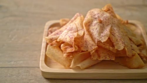 Crispy Taro Chips on a Wooden Plate