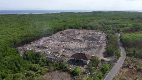Rubbish tip, landfill, waste area in Lembongan Bali drone shot push in