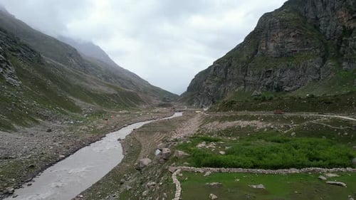 aerial landscape of river flowing through a mountain valley in Himachal Pradesh of India on cloudy d