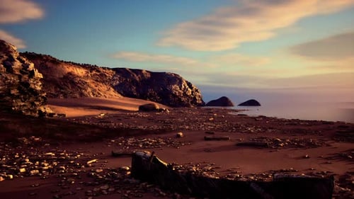 Coastal Landscape Pan at Sunset with Rocky Beach and Ocean View