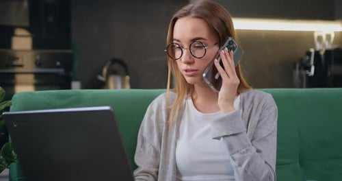 Young Woman Working at Home on Laptop