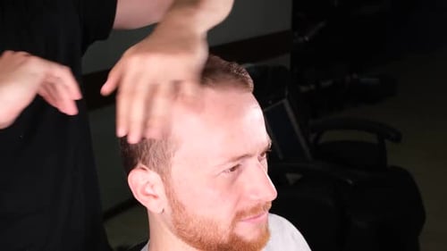 Man receiving hair styling