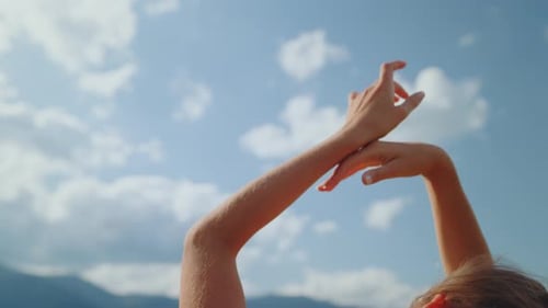 Closeup Gentle Woman Hands in Front Cloudy Sky. Back View of Carefree