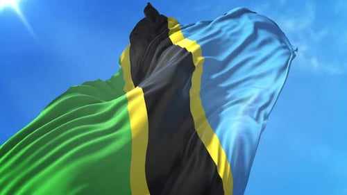 Realistic Tanzania Flag Waving in Blue Sky