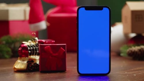 Phone with Green Screen Chroma Key Near Christmas New Year Background Vibes of Winter Holiday Santa