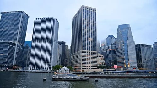 Huge rectangular modern high-rises at the waterfront of the river. Architecture of New York, USA
