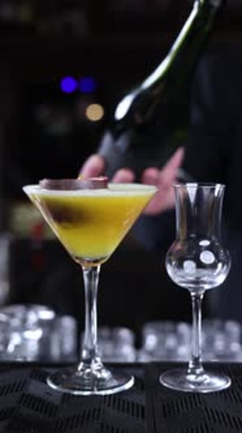 bartender prepares a cocktail at the bar