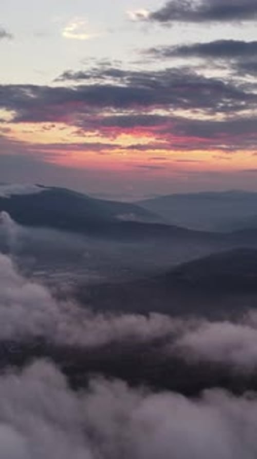 Aerial view of clouds and sunset sun