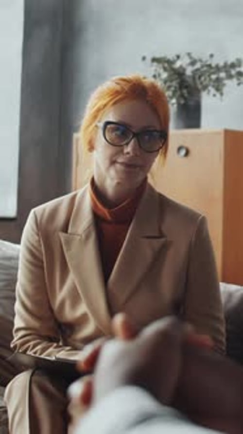 Woman with Orange Hair Listens Patient