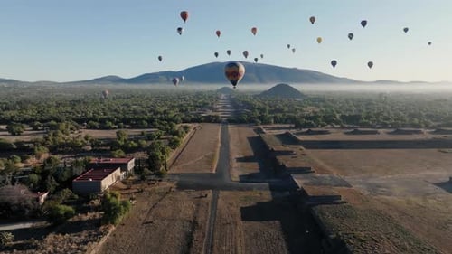 Cinematic Shot Of Teotihuacan City of Gods, Aztec Pyramids, Hot Air Balloons Flying Peacefully,