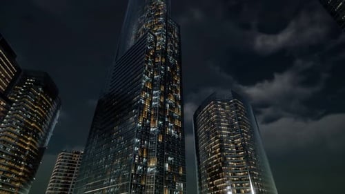 Edificios de oficinas de rascacielos de cristal con cielo oscuro