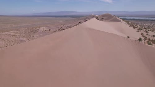 A Large Sandy Dune in the Middle of the Steppe