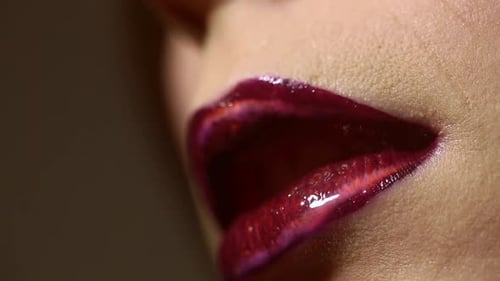 Extreme Close Up of Glossy Red Lips