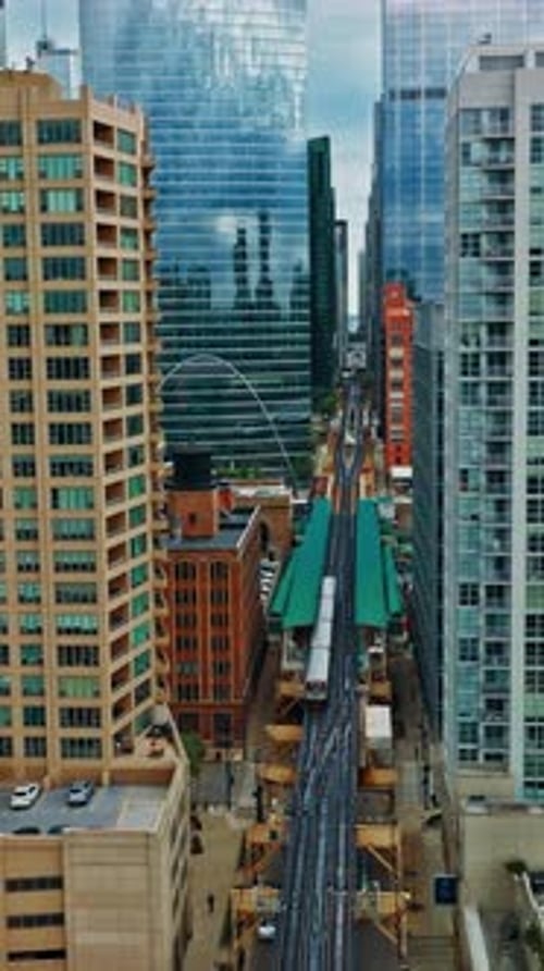 Aerial view of Chicago with train tracks and skyscrapers