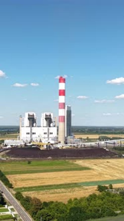 Coal Fired Power Plant, Vertical Drone Shot on Sunny Summer Day