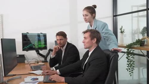 Business Colleagues Working Together in Bright Office