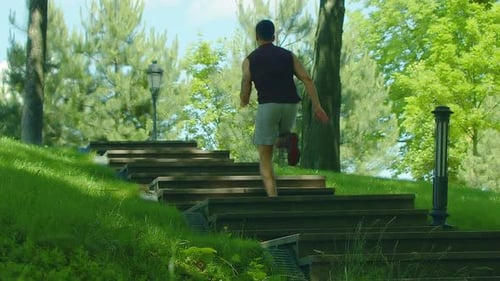 Fitness Man Run Up Stairs Outdoor. Running Man on Staircase in Slow