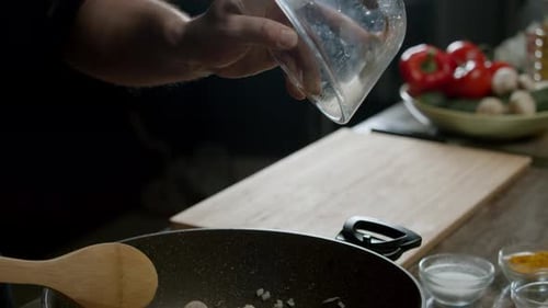 Cook Prepares a Delicious Vegetarian Dish Using Mushrooms They Fry the Mushrooms and Onions in a Pan