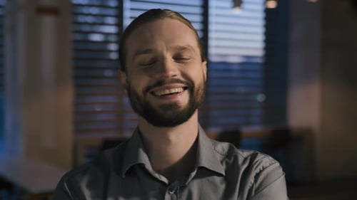Smiling Man in an Office Setting