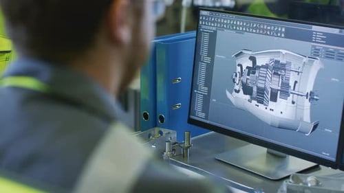Close-up Back View of the Mechanical Engineer Designing 3D Engine Model on Personal Computer. Profe