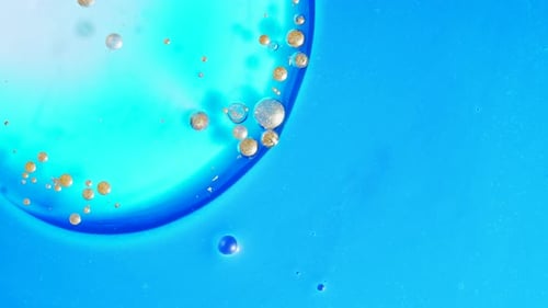 Abstract Bubbles and Blue Liquid Close-Up
