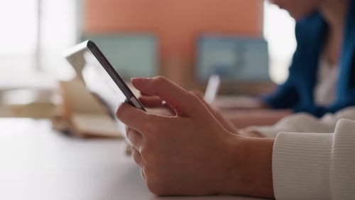 Woman Types on Tablet in Public Library Hall