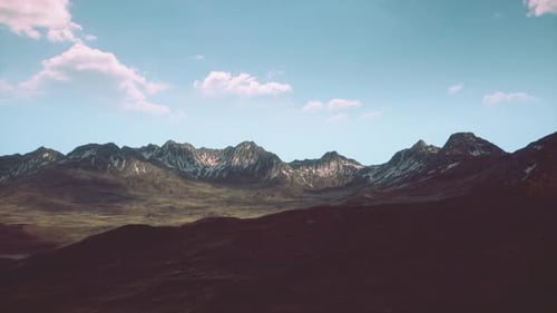 A Majestic Mountain Range with Picturesque Clouds in the Sky