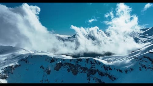 Snowy Mountain Peaks Under a Clear Blue Sky