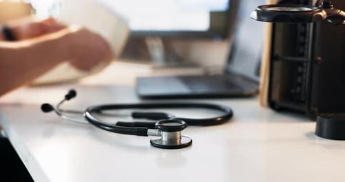 Stethoscope, medical and hands of doctor in hospital for cardiology consultation with diagnosis