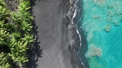Aerial View Scene of Hawaii Island with Black Lava Sand Beach and Teal Seawater