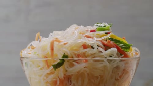Glass Noodles Salad with Meat and Carrots Fermented Close Up Asian Chinese Traditional Food
