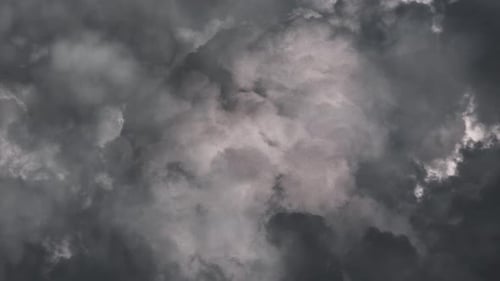 Heavy thunderstorm in dark sky with black clouds