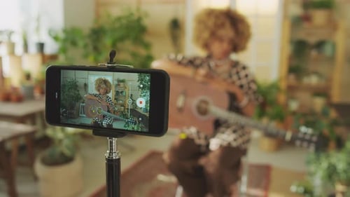 Young Adult Recording Guitar Performance