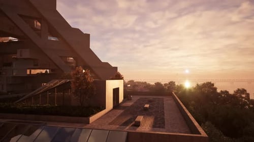 Una impresionante puesta de sol sobre un edificio con una piscina reluciente