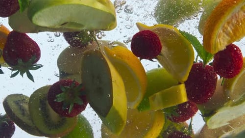 Fresh Fruits and Berries Falling into Water