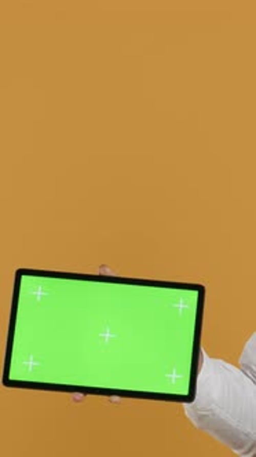 Vertical Video Catering Employee Presenting Isolated Chroma Key Display While He Wears an Apron