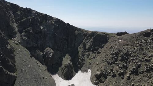 Drone view of snow ruins in the high mountains of the Black Sea, view from the top of the mountains