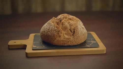 Close up Of Bread Being Lifted From Board