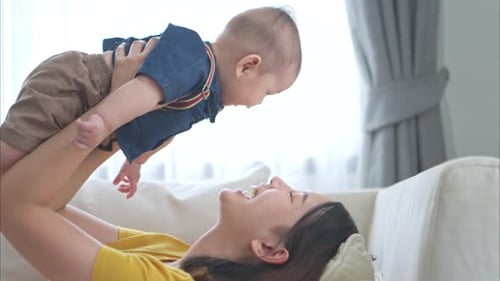 Mother and Baby Enjoy Playtime Together Indoors