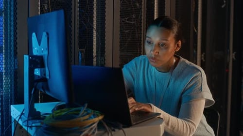 Woman working with server in a data center
