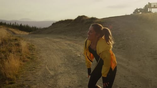 Sports Woman Jumping On Trail. Excited Girl Enjoying Good Results After Training Outdoor. Smiling...