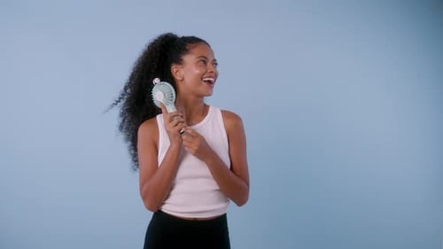 Woman Cooling Herself with a Handheld Fan
