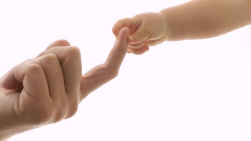 Baby Holding Parent Finger Showing Connection and Love